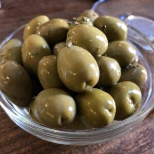 Olives in a small plate as a snack