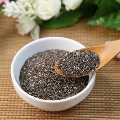 Chia Seeds in a bowl with wooden spoon